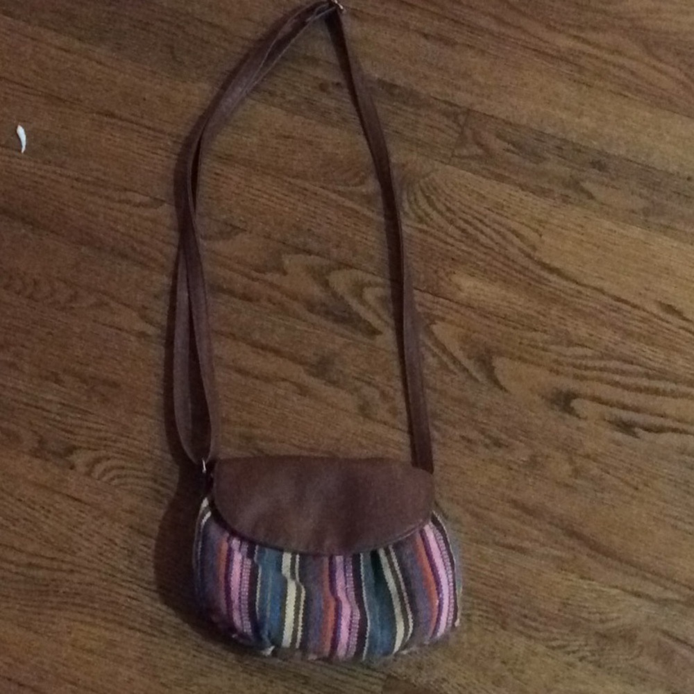 a little purse with a zipper and magnetic shut.